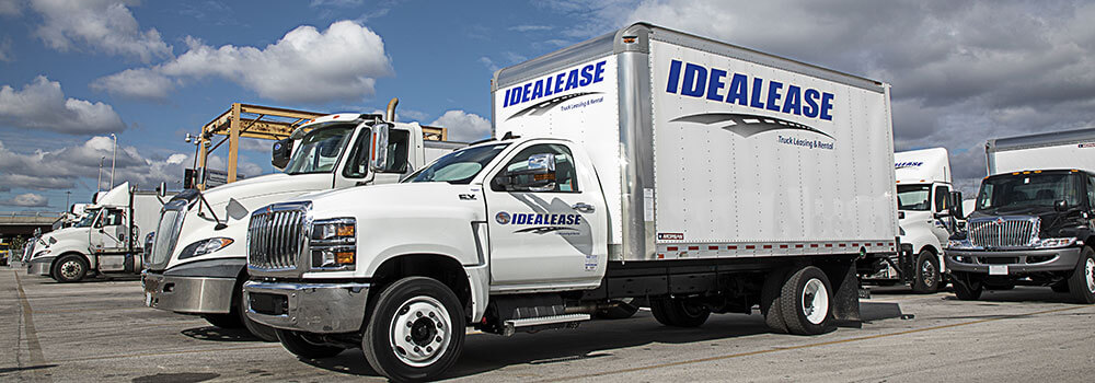 A group of parked Idealease trucks