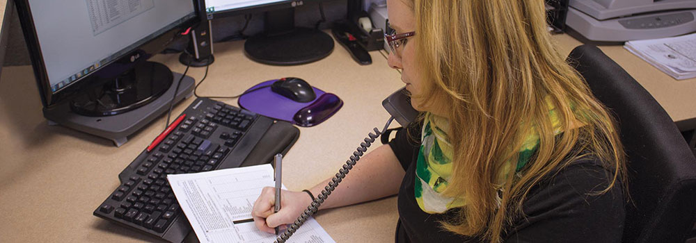 Woman filling out paperwork